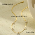 Detail of gold snake chain necklace with five white daisy flowers on stone display - Gold Snake Chain Five White Flowers (NMSN-F642-1)