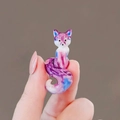 Miniature fox brooch with purple and blue marble pattern finish shown in hand - Mini Fox (DW0035) / Purple