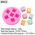 Pink silicone cube mold B802 with six dotted cavities and colorful finished samples - Dice Shaped Mold (B802) / Pink