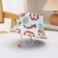 Detail of light blue kids sun hat with lion print and adjustable white chin strap - Light Blue Lion