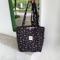 Quilted black tote bag with yellow floral pattern and shoulder strap for daily use - Black Apricot Shoulder Tote Bag