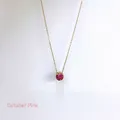 Detail of October birthstone necklace with pink round zircon pendant in gold plating - October Pink