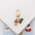 Golden Christmas keychain with cute reindeer charm and Merry Christmas green enamel pendant - Elk