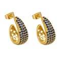 Macro detail of gold plated C-shaped hoop earrings with pave-set deep blue cubic zirconia - Blue