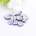 Detail shot of silver crystal spacer beads with blue rhinestones for DIY jewelry making - Silver Plated Light Blue