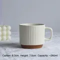 Cream striped ceramic mug, 260ml capacity, 8.3cm diameter with textured vertical patterns - White Brown Patchwork