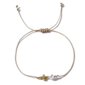 Champagne woven rope bracelet with gold cross pendant and white round pearl detail - Cross Style