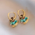 Golden earrings with blue enamel rocking horse pendant on a champagne silk background - Gold Blue Enamel Hoop Rocking Horse (18#)