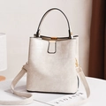 Chic beige crocodile embossed bucket bag with gold hardware and adjustable strap - White Stone Pattern