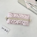 Detailed view of pink quilted pencil case with heart pattern and zipper closure - Heart Pink