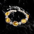 Adjustable silver bracelet with five oval yellow gemstones in floral cluster settings - Yellow Zirconia Bracelet