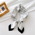 Elegant silk scarf featuring black and white abstract Chanel letters on white satin surface - Sketch Floral White