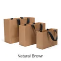 Three-piece natural brown kraft paper gift bag set with elegant black ribbon handles - Natural