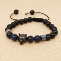 Detail of beaded bracelet with tiger eye stones, obsidian beads, and black metal wolf head - Type C Obsidian + Blue Tiger Eye
