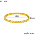 Macro view of gold 18K plated bangle with hexagonal texture showing 6.0cm inner diameter - Inner Diameter 6.0cm Width 0.6cm / Gold (Honeycomb)