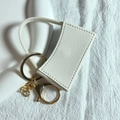 Portachiavi porta rossetto in pelle bianca con anello dorato e chiusura a scatto - Grigio