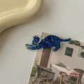 Detalle de pinza para pelo de gato azul oscuro con purpurina dorada en borde cerámico - Azul Galaxia