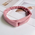 Pink knitted ribbed headband for yoga with a stylish twisted knot design for women - Knitted Brick Red