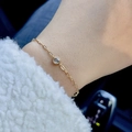Pulsera minimalista de acero inoxidable bañada en oro de 18k con una sola piedra de circón - Cadena de Clip Circonita Transparente