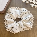 White polka dot fabric hair scrunchie with cream lace trim on a rustic wooden background - Lace Edge Style / White Polka Dot Pleated Scrunchie
