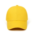 Close-up of bright yellow cotton twill baseball cap with six-panel design and curved brim - Yellow