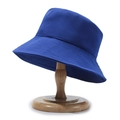 Royal blue bucket hat with reinforced stitching on the brim displayed on a wooden stand - One Size / Sapphire Blue