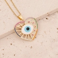 Macro detail of heart-shaped evil eye pendant with colorful CZ stones and enamel - Lake Blue (1#)