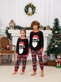 Pigiama natalizio per bambini con stampa Babbo Natale in una calda cornice festiva - S / Stile Bambini