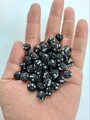 Macro detail of hand-held 10mm black disco clay beads with sparkling rhinestones for jewelry DIY - 10mm / Black+White