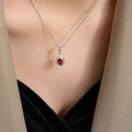 Vintage Thai style silver necklace with oval red crystal pendant on elegant female model - Necklace / Steel Red Zirconia / 40+5cm