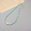 Handmade turquoise and baroque pearl necklace with golden metal spacers in boho style - Necklace