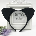Close-up of black plush cat ear headband made of faux fur for cosplay parties - Black Cat Ears