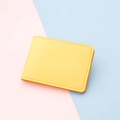 Slim minimalist 2-slot card holder in bright yellow leather with detailed stitching - Yellow