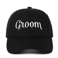 Detailed close-up of white Groom cursive embroidery on a black cotton baseball cap - Groom (GROOM) / Black
