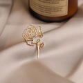 Elegant gold plated alloy rose brooch with hollow design on silk fabric backdrop - 551# Hollow Rose