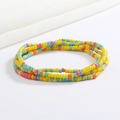 Close-up of vibrant yellow, blue, and red beaded waist chains with elastic stretch design - Yellow Blue Coral Red