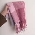 Pink and grey checkered cashmere-feel scarf with tassels held against a plain wall - 180*70cm / Watermelon Red