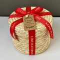 Detail of round straw gift box featuring red silk ribbon and vintage Thank You tag - Red Bronzing (Self-tie) / Large (Dia 24*H 17cm)