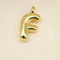 Polished gold balloon style letter F pendant with smooth metallic finish for jewelry - Letter F