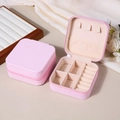 Pink portable PU leather jewelry box with zipper closure and ring storage slots - Sakura Pink