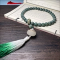 Carved green Bodhi seed bracelet with white lotus pendant and silk tassel ornament - Hand-held Imperial Green (Luminous Lotus)