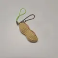 Funny peanut fidget toy with pink bean keychain for stress relief on gray background - Unpackaged Squeeze Peanut