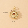 Detailed view of a gold sun pendant with evil eye center and multicolored crystals - Gold Sun God Eye with Orange-Red Main Stone Pendant (K)