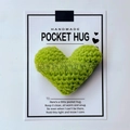 Detail of green handmade crocheted heart attached to a Pocket Hug greeting card - Grass Green