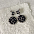 Detail of silver drop earrings with black oval gemstones and sparkling white zircons - Silver Base Black Rhinestone