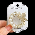 Elegant gold butterfly brooch with white pearls and sparkling rhinestones for women - Pearl Butterfly Wreath