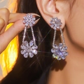 Boucles d'oreilles fleurs argentées scintillantes avec strass et design géométrique - Fleur à Double Couche / Argent