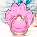 Macro shot of a pink cat paw metal phone ring holder with blurred floral background - Cat Paw Magenta Border Pink