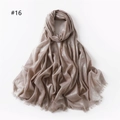 Detail view of champagne metallic glitter scarf with fringe tassels and soft drape texture - Light Khaki