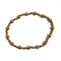 Dettaglio di grandi e piccole perline in oro 18K alternate su un braccialetto elastico - Perline da 3mm+5mm / Oro